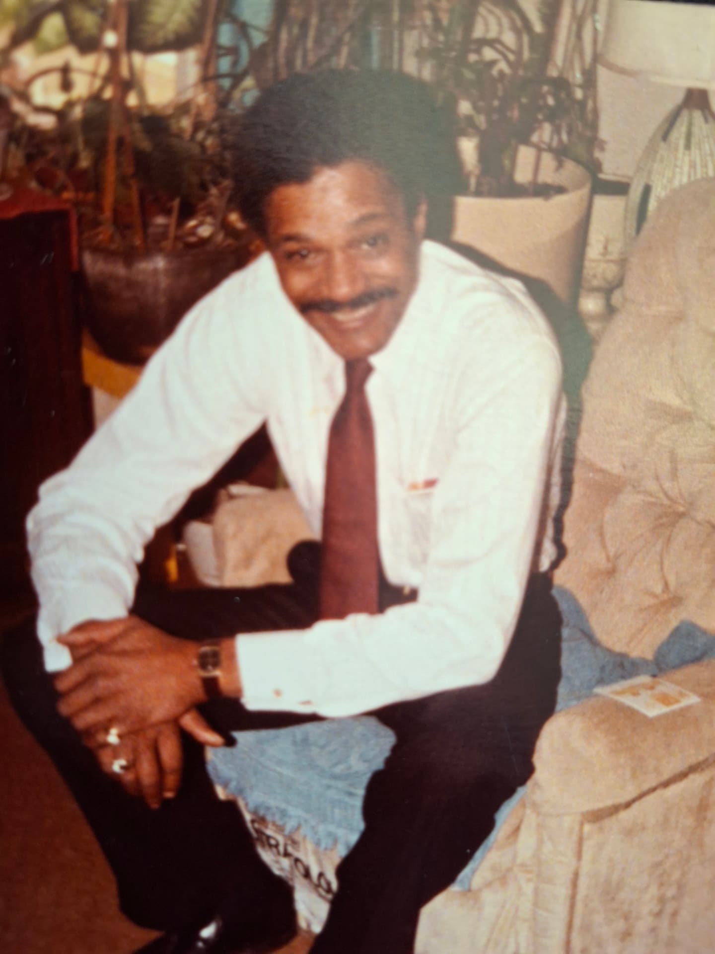 Harvey James Gardner, smiling in a white shirt and tie — the father honored by The HJG House